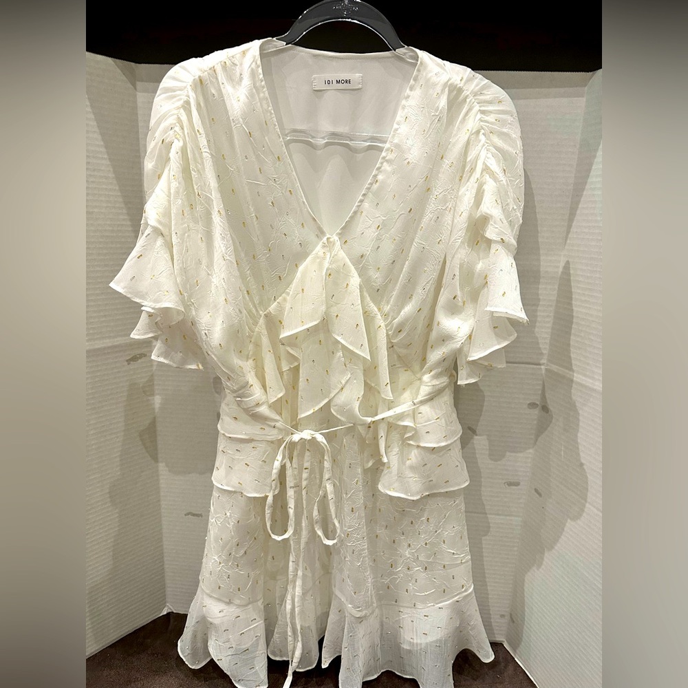 White ruffle mini dress with silver and gold details
